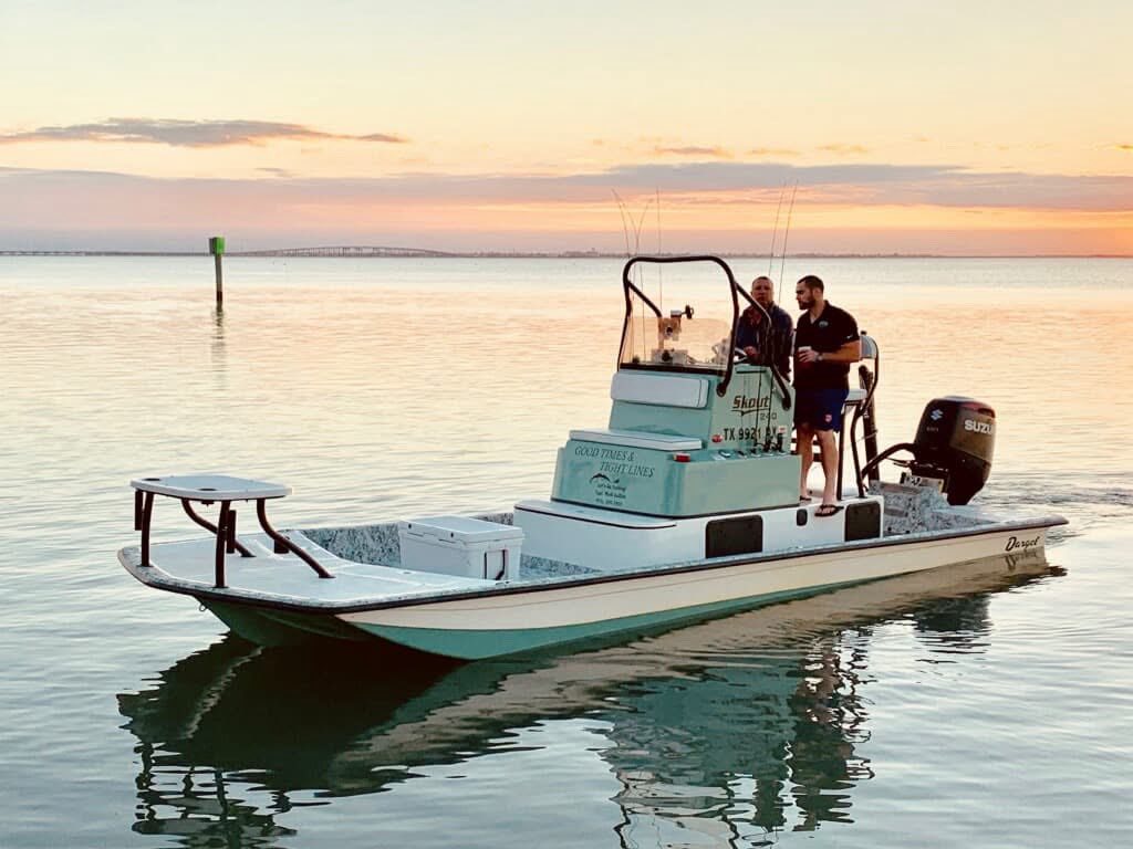 Fishing boat on calm water at South Padre Island TX during sunset