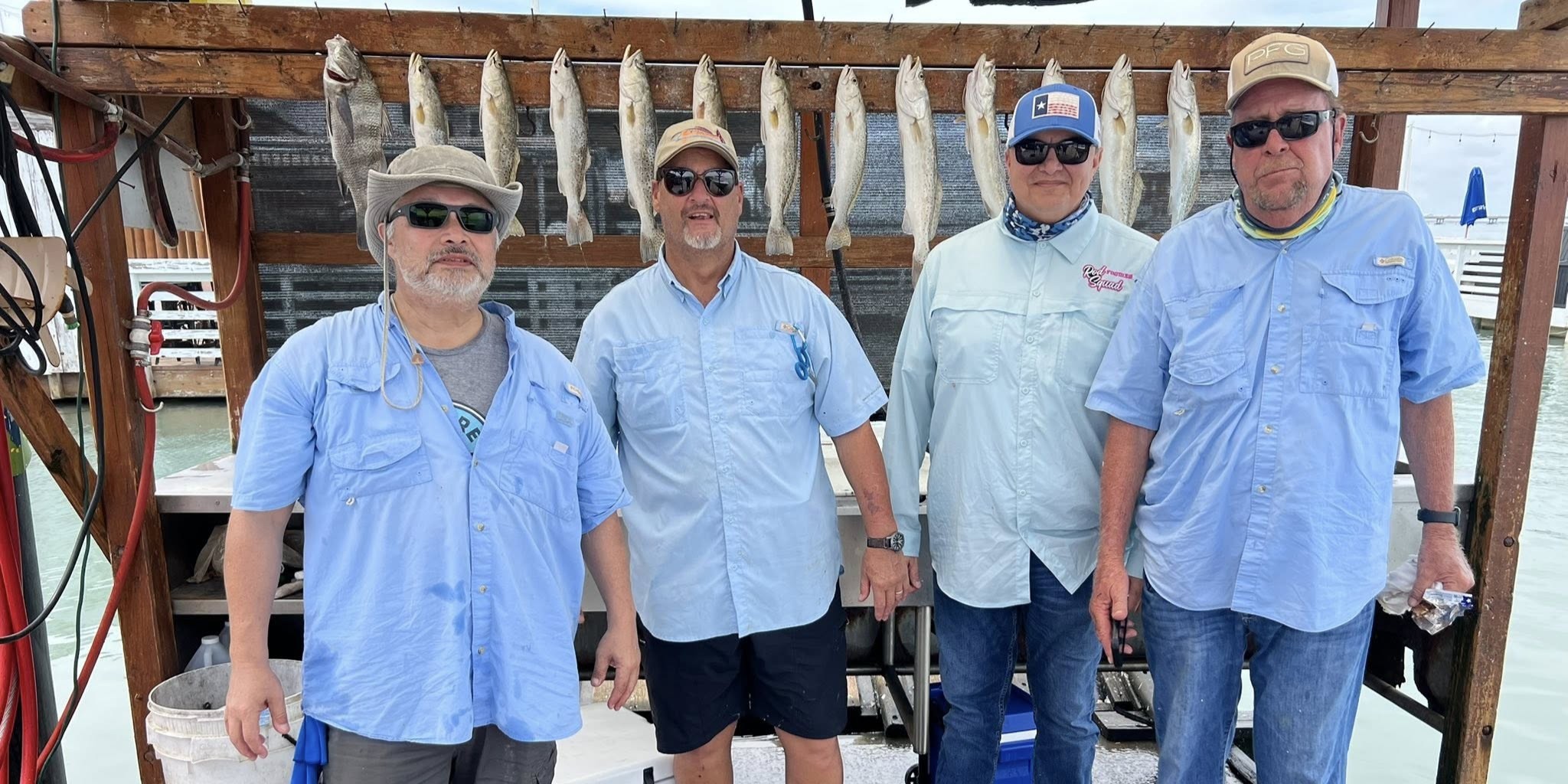 Professional anglers fishing for redfish and tarpon on 24ft Dargel boat in South Padre Island waters