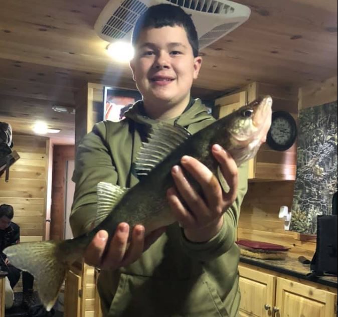 Two anglers with a big 21-inch fish in Minnesota