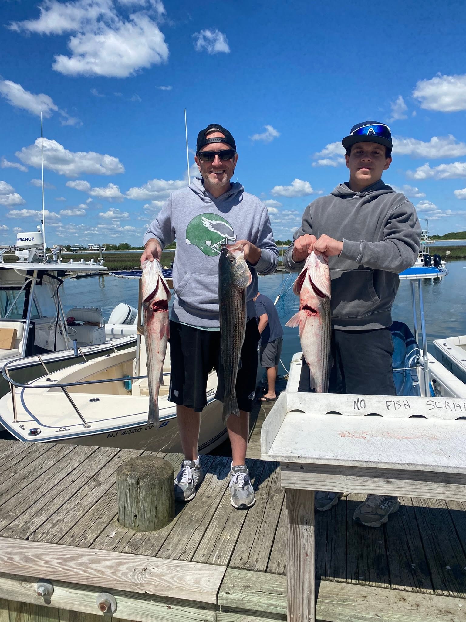 Successful striped bass fishing trip at Barnegat Light NJ with multiple fish caught