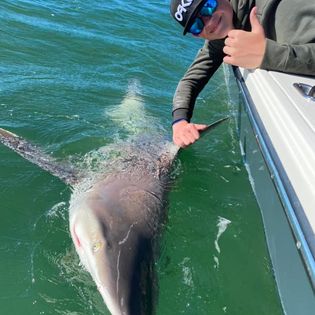 Angler catching a 15-inch fish in FL