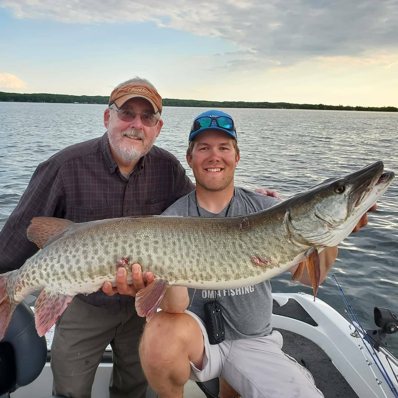 Muskellunge fish caught by two people in Onamia