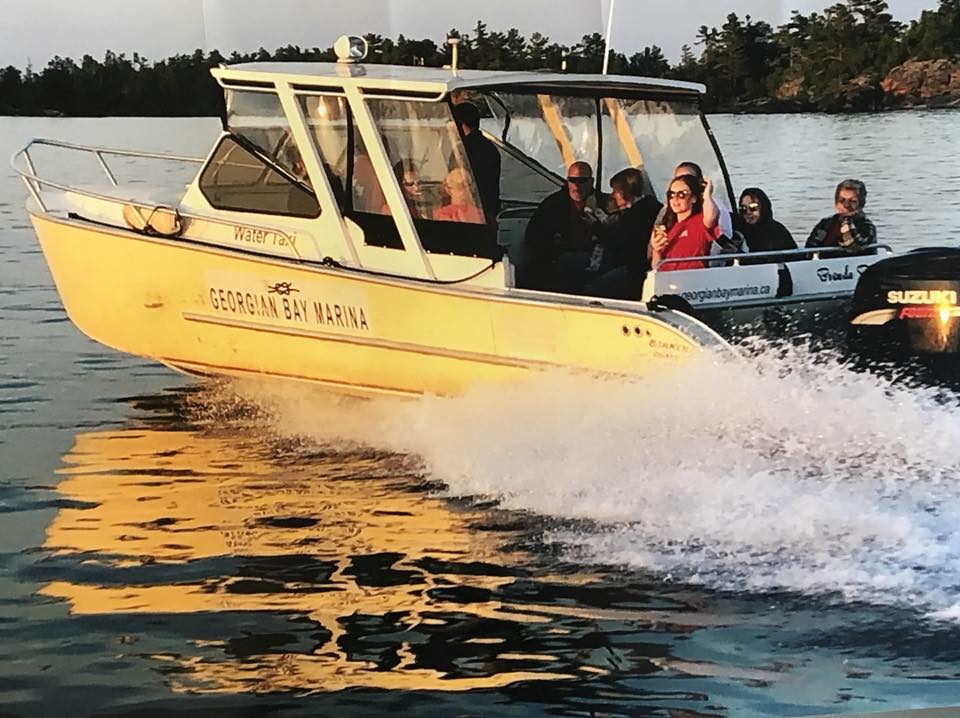 Four people enjoying a fishing tour in Parry Sound