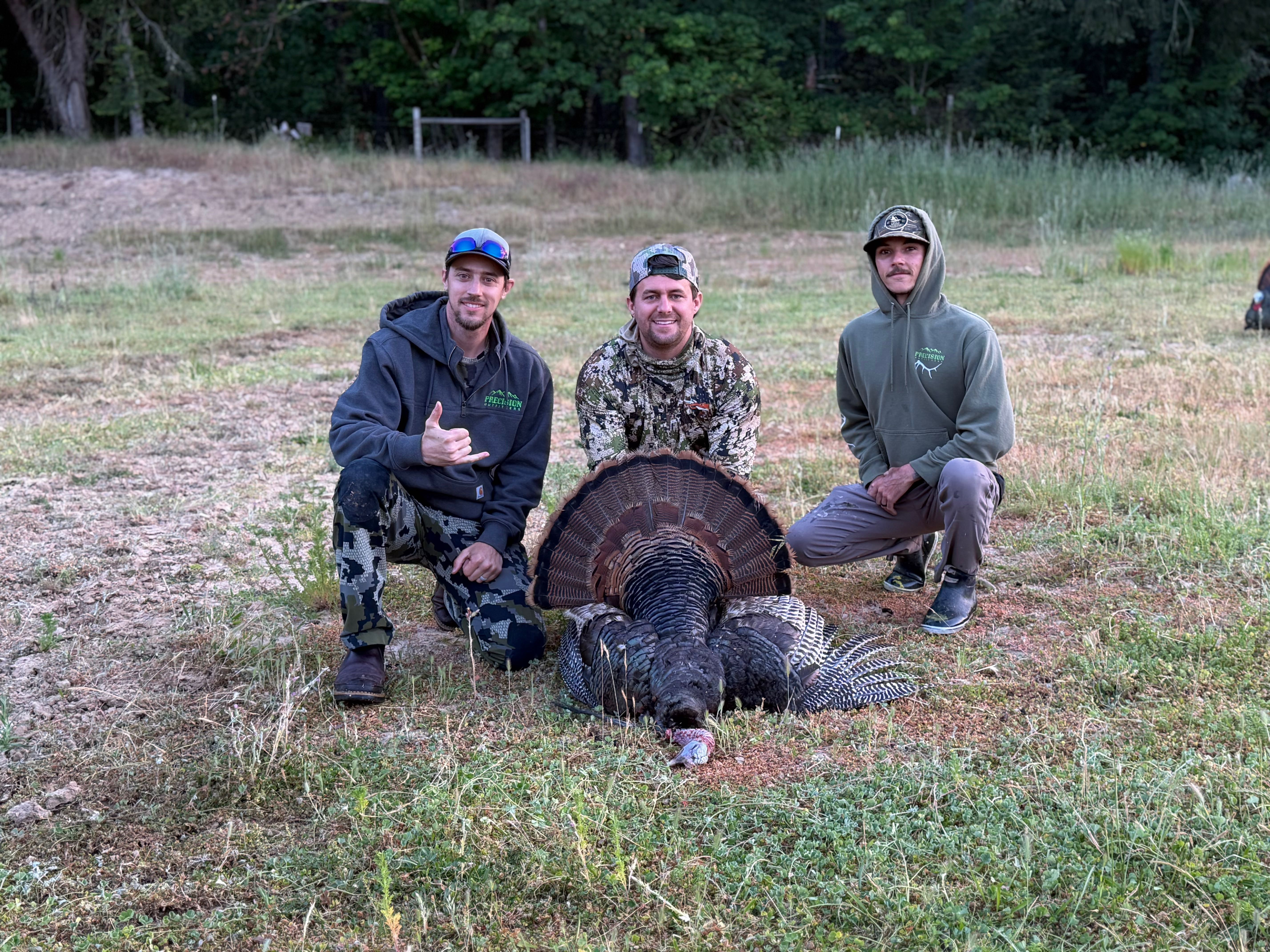 Turkey hunting success in Winchester Bay OR with harvested wild turkey displayed in field