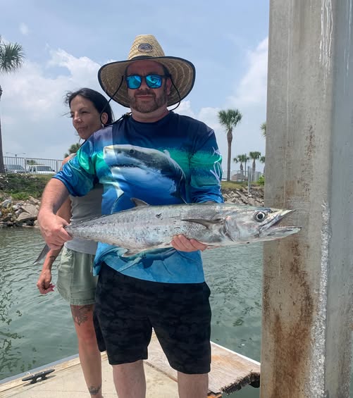King mackerel catch displayed at New Smyrna Beach FL fishing location