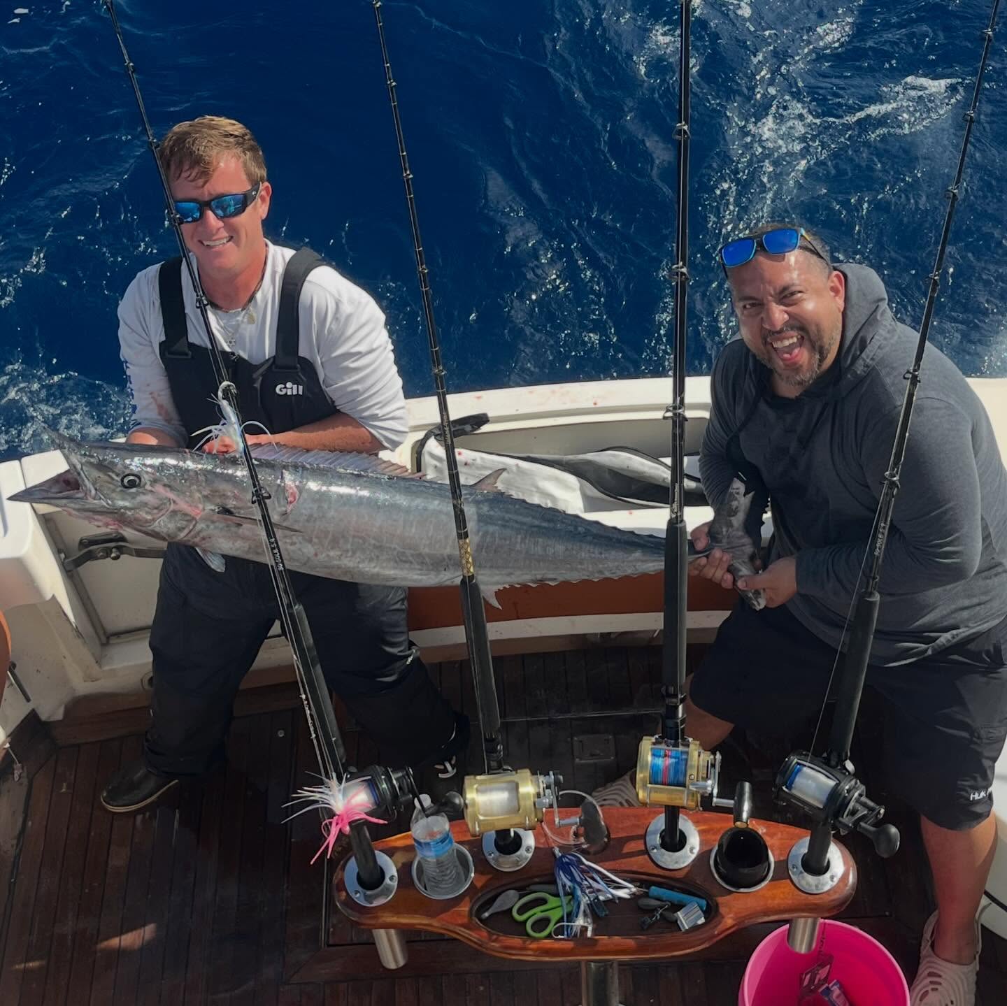 Deep sea fishing catch displayed on boat with fishing rods and equipment in Miami FL