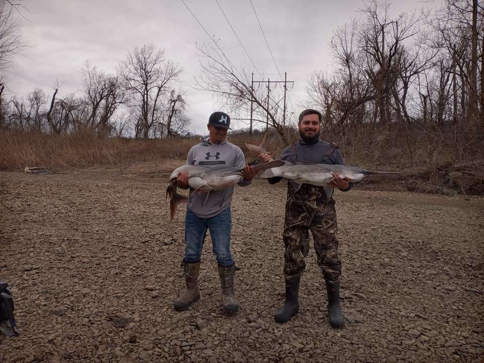 A photo of two people fishing in OK
