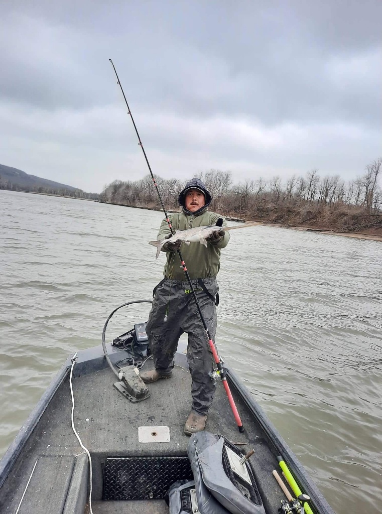 Person enjoying fishing in Checotah