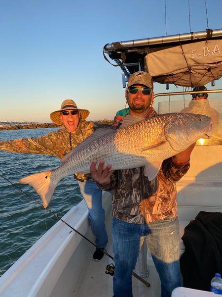Anglers fishing in Florida with a big 36-inch catch