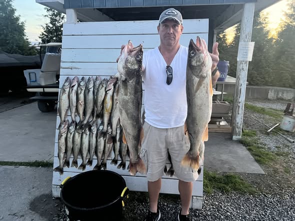 Fishing catch display showing walleye and salmon from Port Clinton OH
