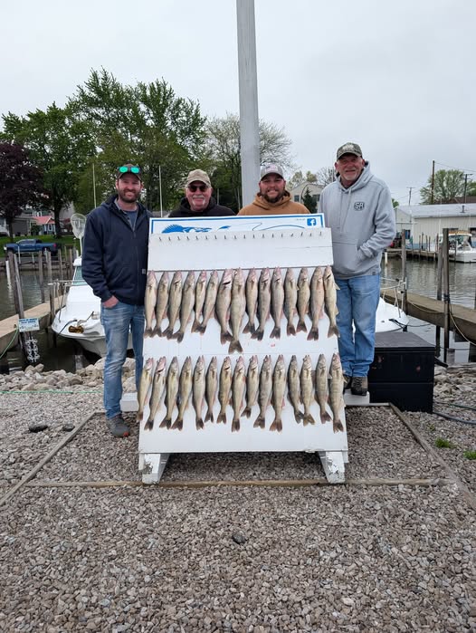 Fishing charter catch display with multiple fish arranged on cleaning station at Port Clinton OH marina