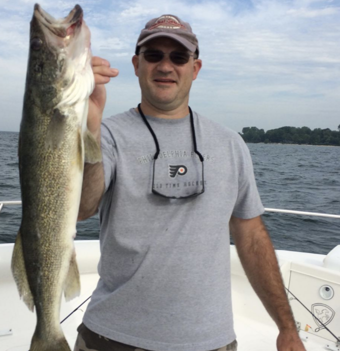 A lone angler fishing at the lakeside in Marblehead