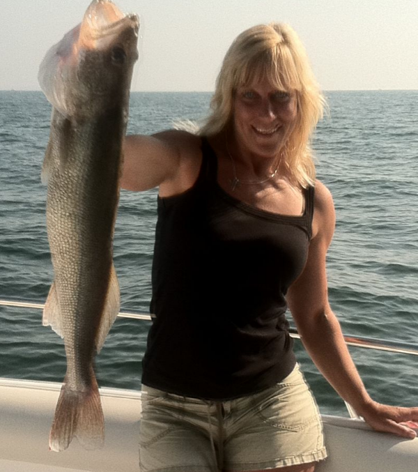 Angler fishing with rod and reel at Lakeside Marblehead