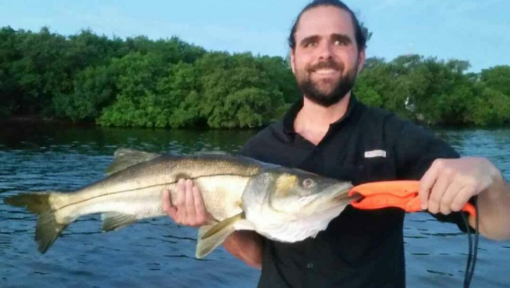 Fisherman with a large 23-inch catch at Apollo Beach