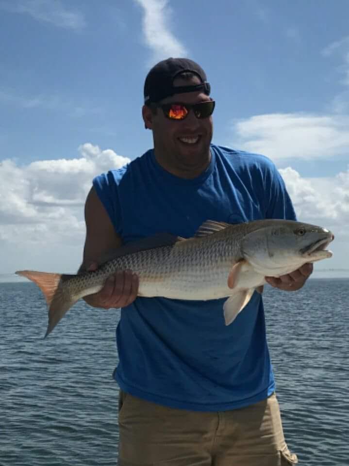 Angler with a 23-inch redfish in FL
