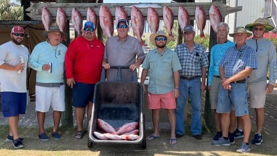Group of 10 people fishing at Orange Beach