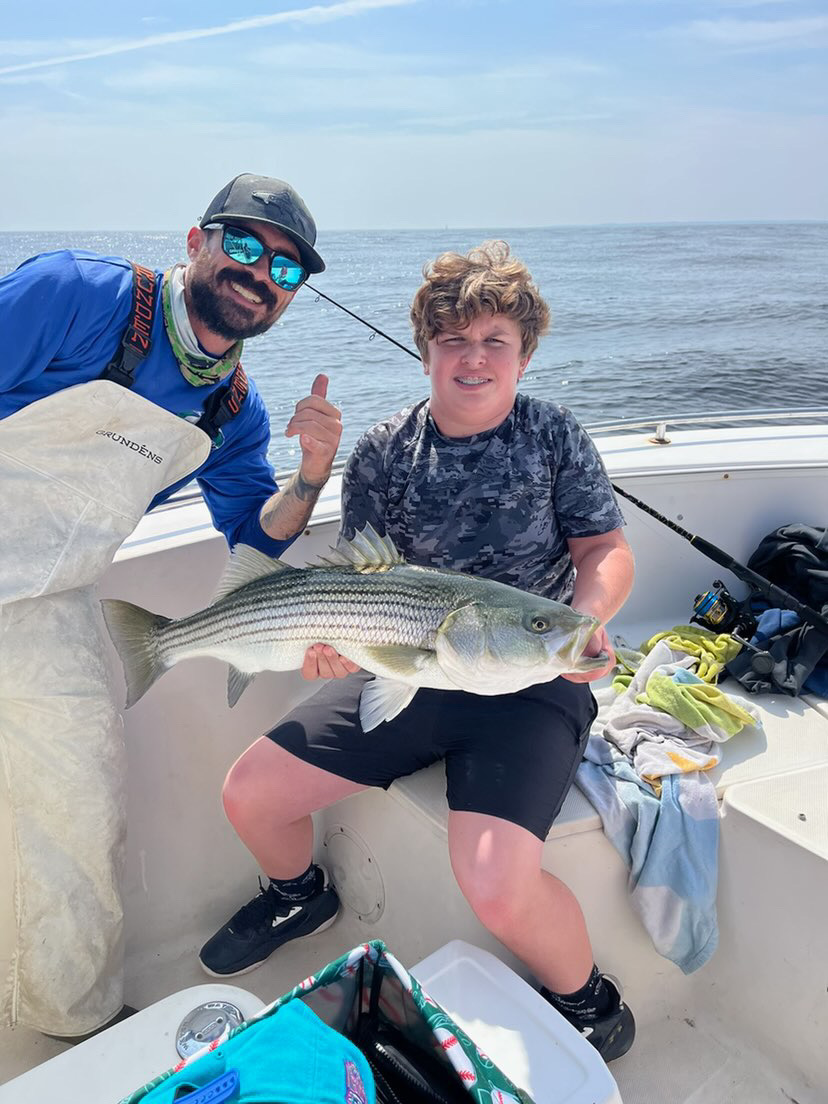 A striped bass caught in MA while fishing