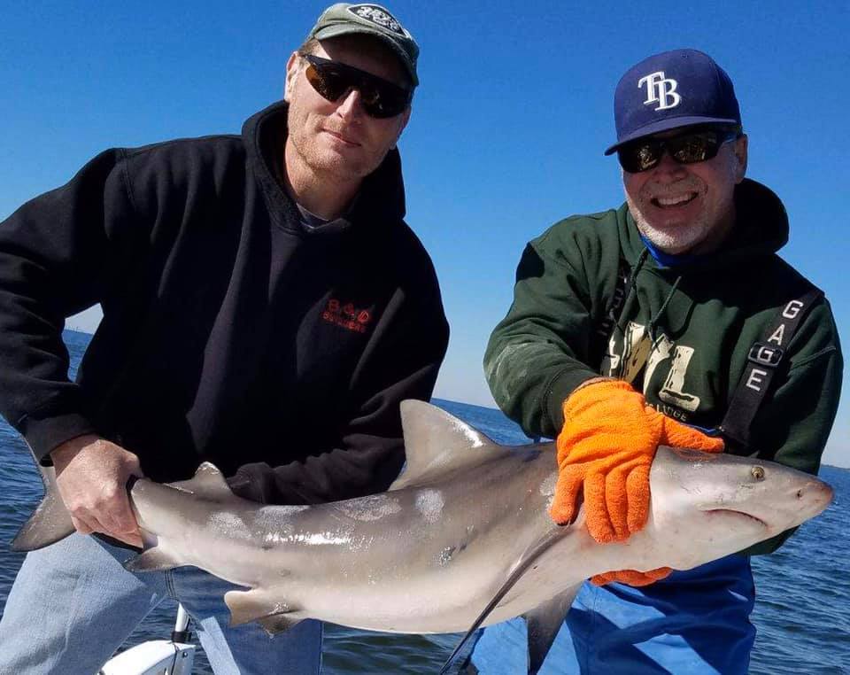 A photo of two people fishing in Tampa, Florida