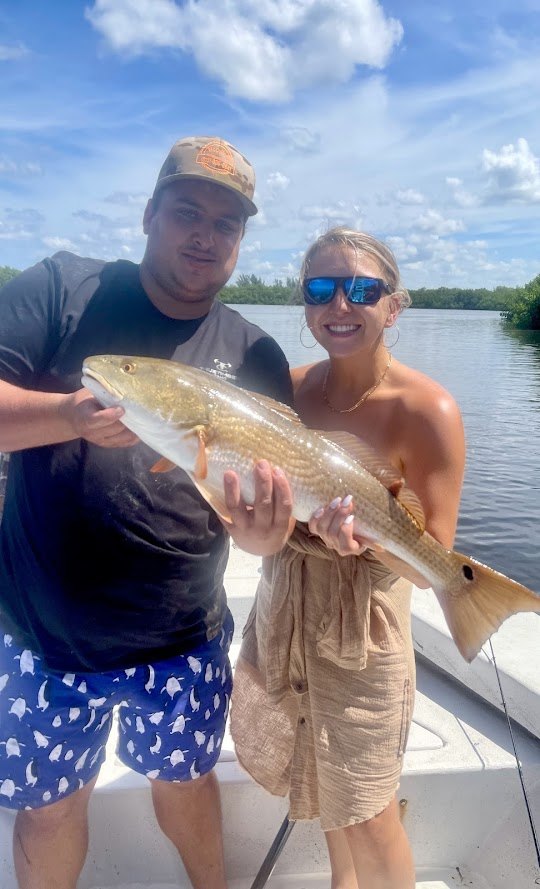 Two anglers casting fishing rods in FL