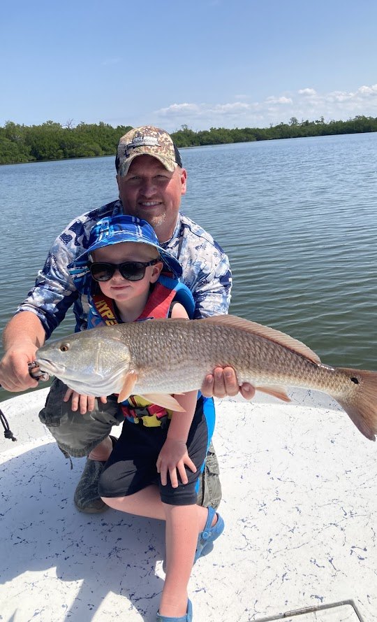 Redfish caught by two anglers in Bokeelia