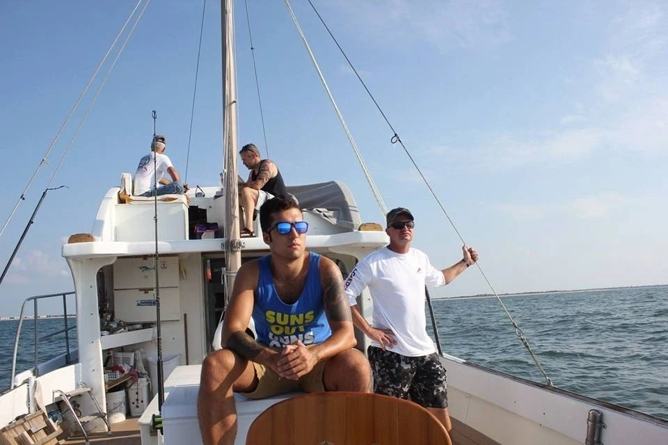 Four friends enjoying a fishing trip in Morehead City