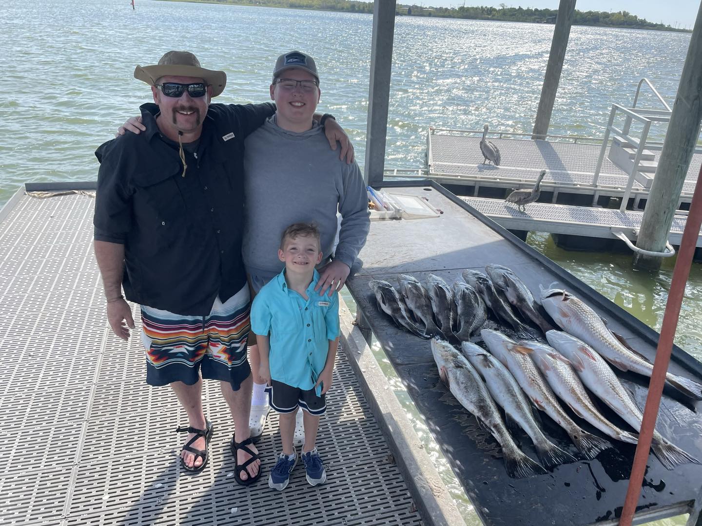 Two fishermen with their catch at San Leon