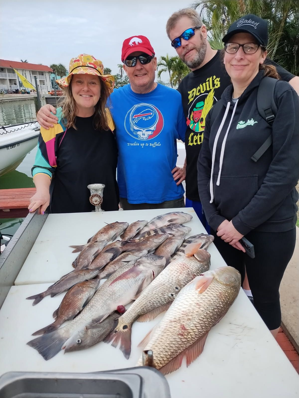 4 people fishing on Treasure Island