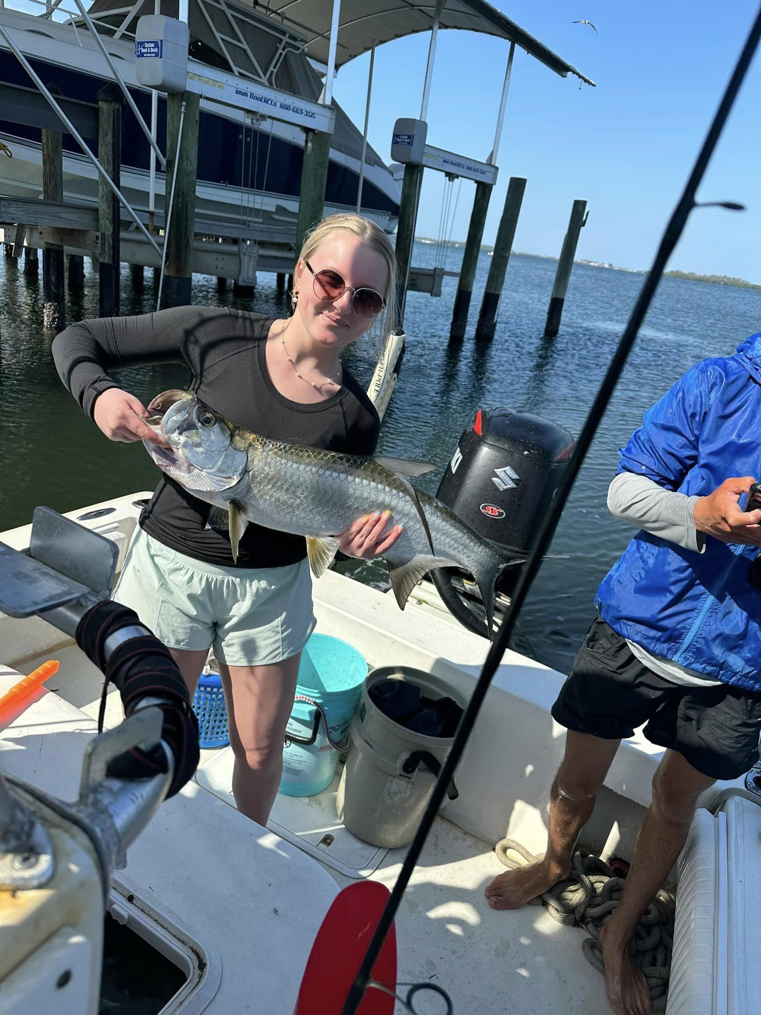 A tarpon fish caught in FL by two people fishing.