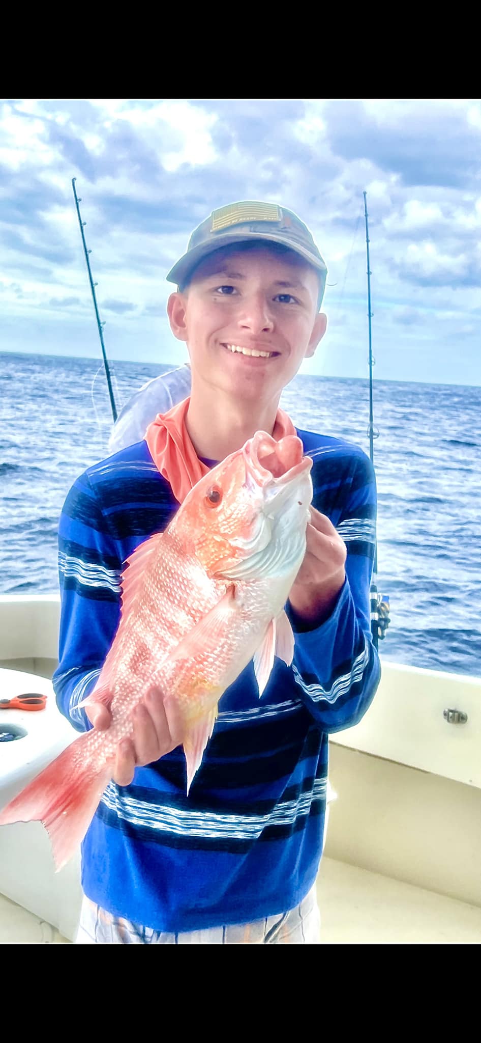 One angler reeling in a 14-inch catch at Port Canaveral