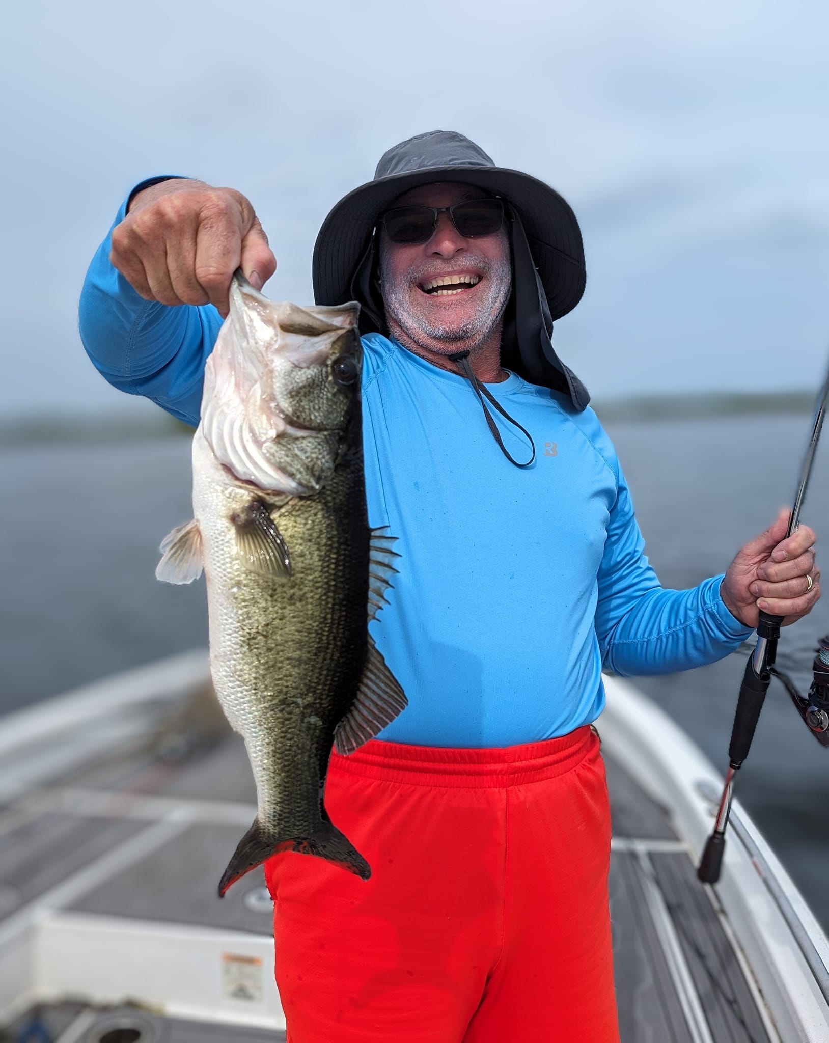 A person fishing for a largemouth bass in Palm Bay