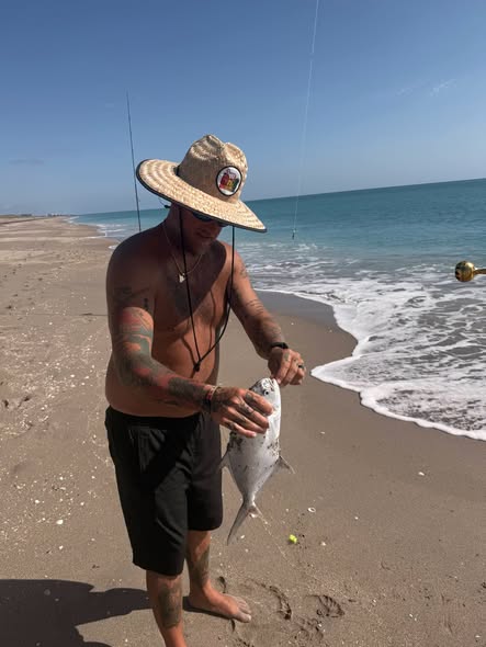 Fresh caught fish being held on beach at New Smyrna Beach FL