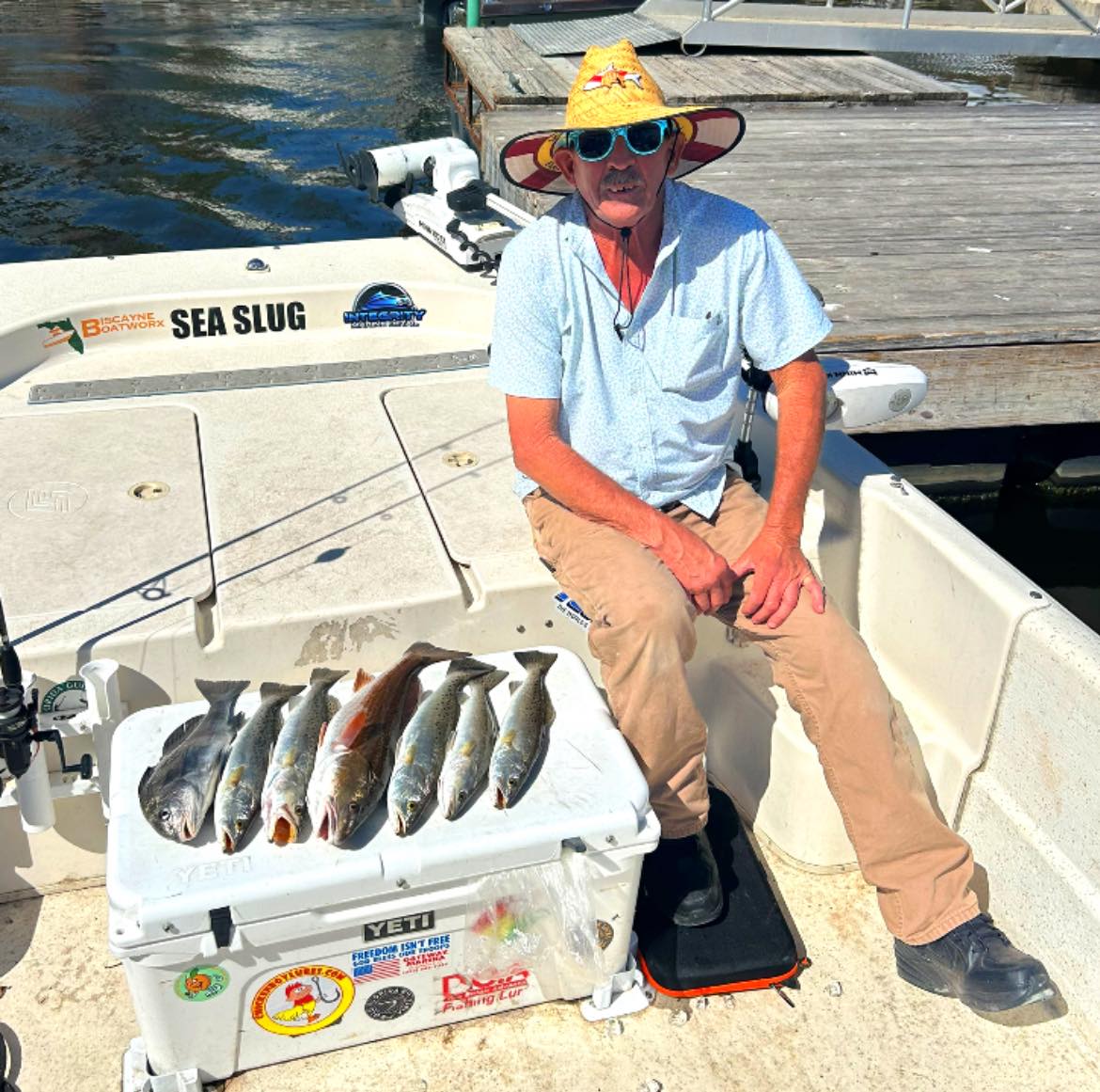 Fresh caught speckled trout and redfish displayed in cooler on fishing boat in New Smyrna Beach FL