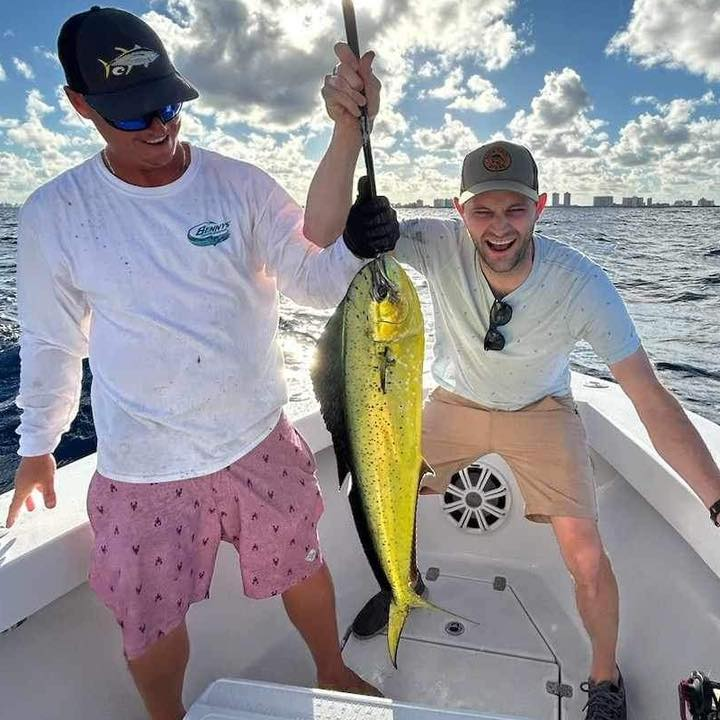 A pair of anglers with a big 21-inch catch at Pompano Beach