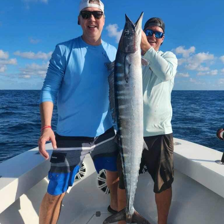 Wahoo fish caught by two people in Florida while fishing