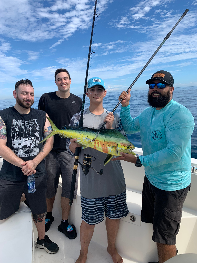4 people holding a 29-inch fish in FL