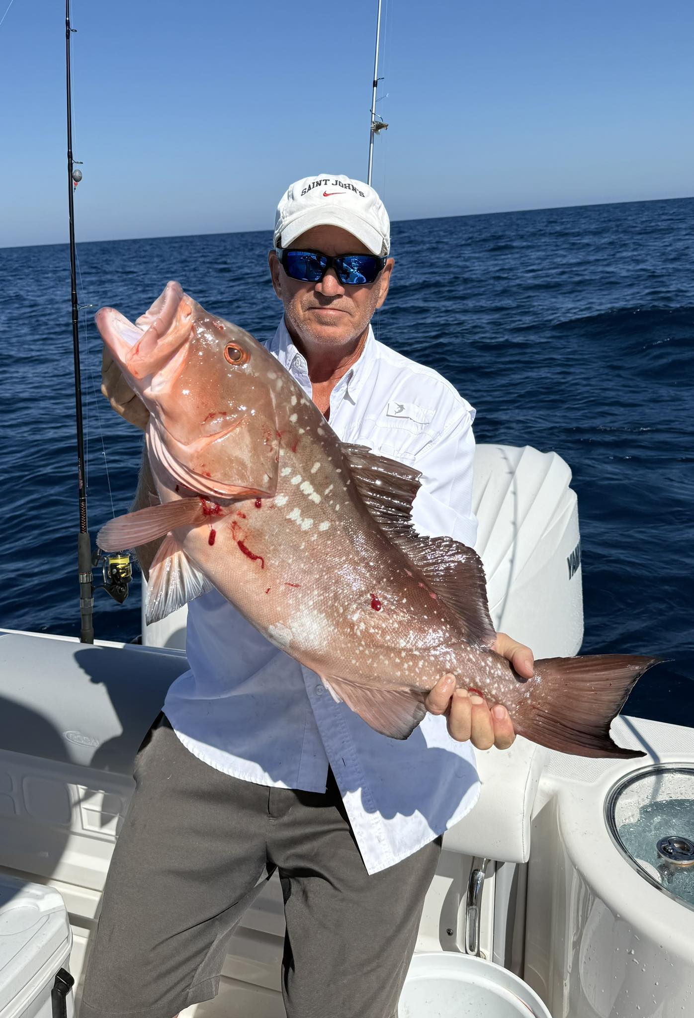 Red grouper catch displayed on fishing boat in Fort Myers FL waters