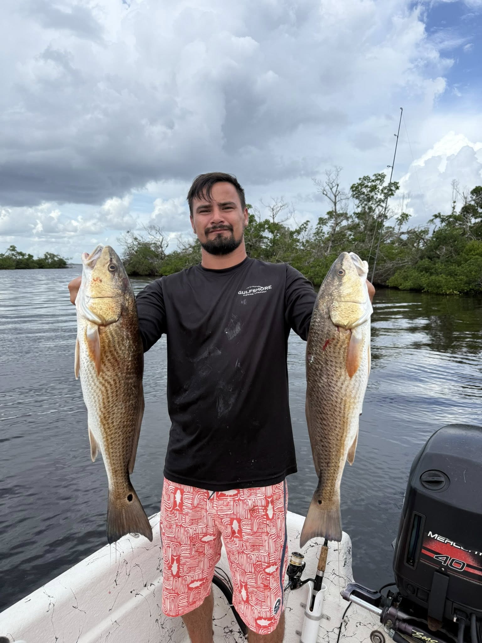 Two redfish caught while fishing in Fort Myers FL displayed on boat