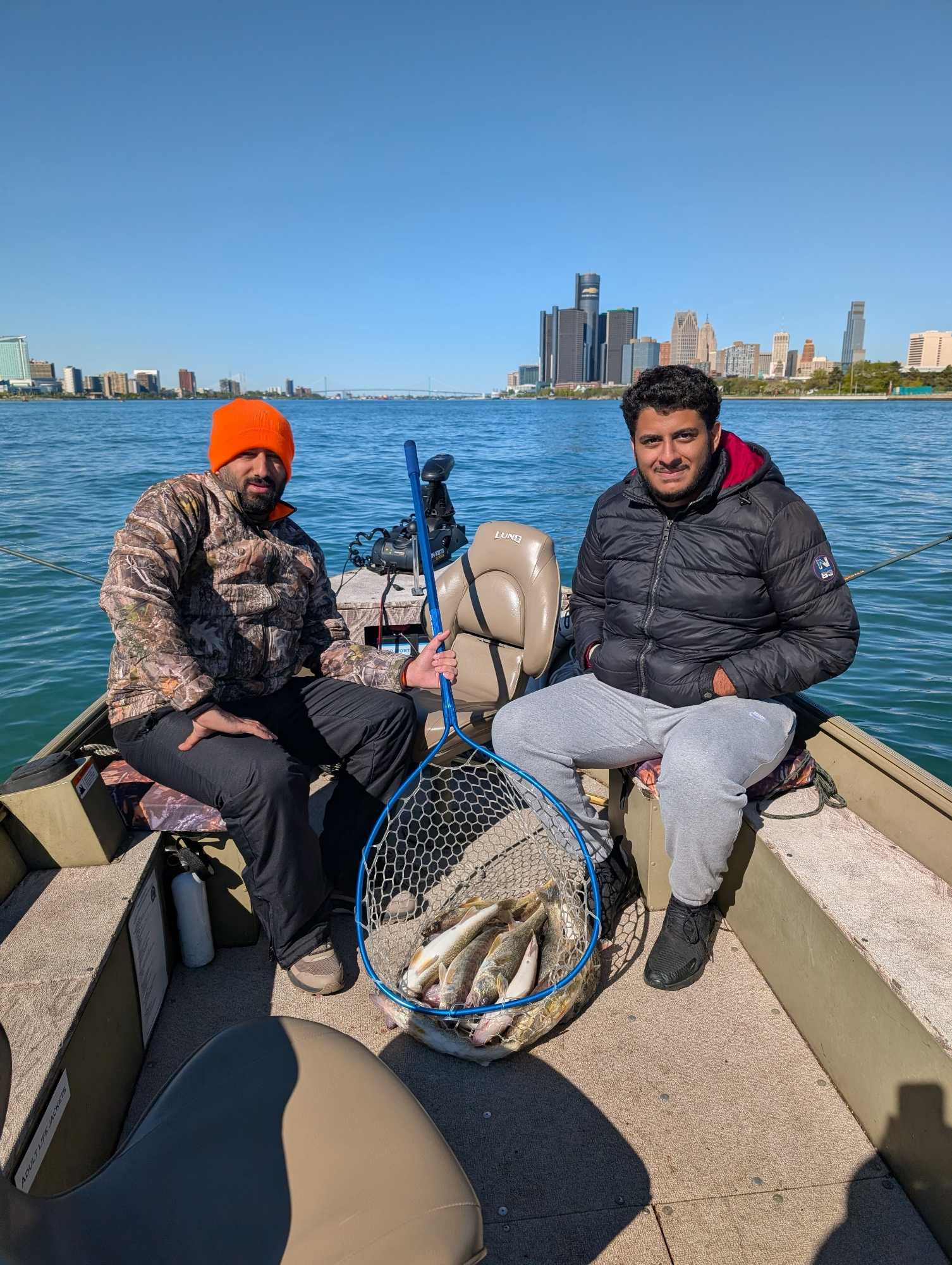Fishing boat on water with net full of caught fish in Detroit MI