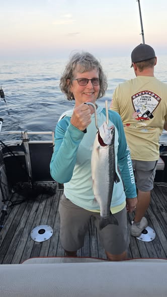Coho salmon catch displayed on fishing boat deck in Whitehall MI