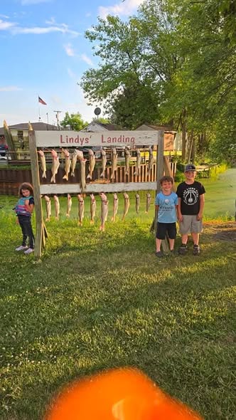 Fish cleaning station with freshly caught fish displayed at Whitehall MI fishing location