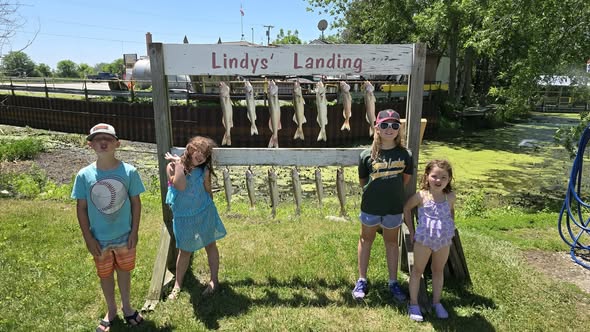 Fish cleaning station with caught fish displayed on rack at Whitehall MI fishing location