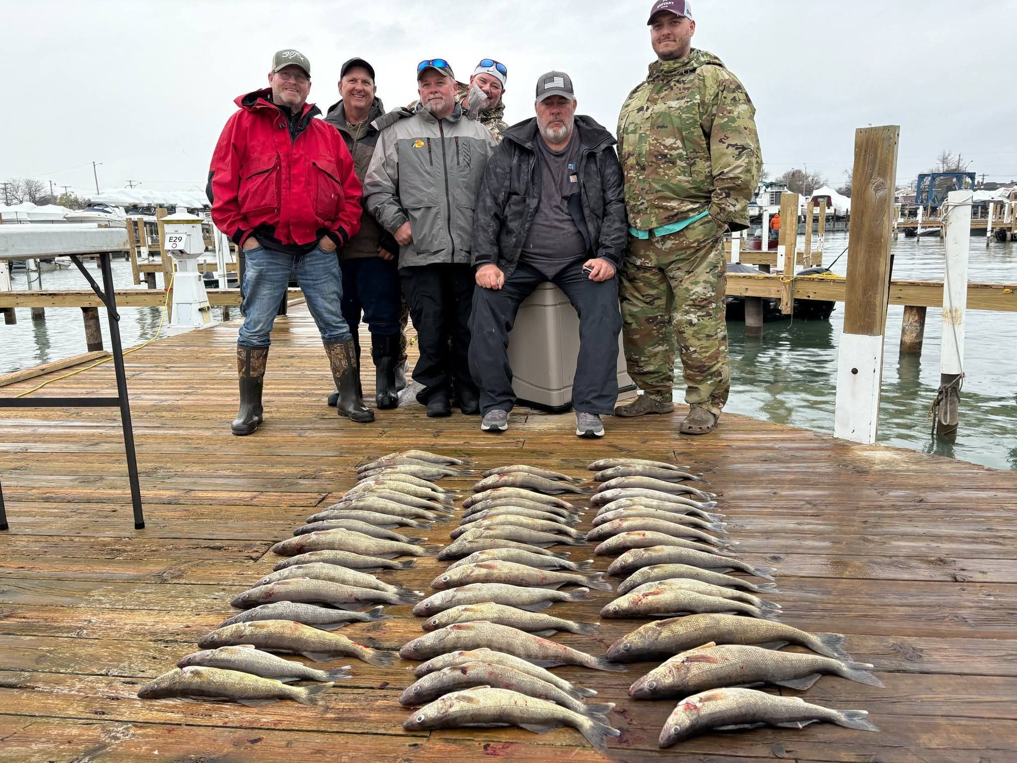 Large walleye catch displayed on wooden dock in Whitehall MI