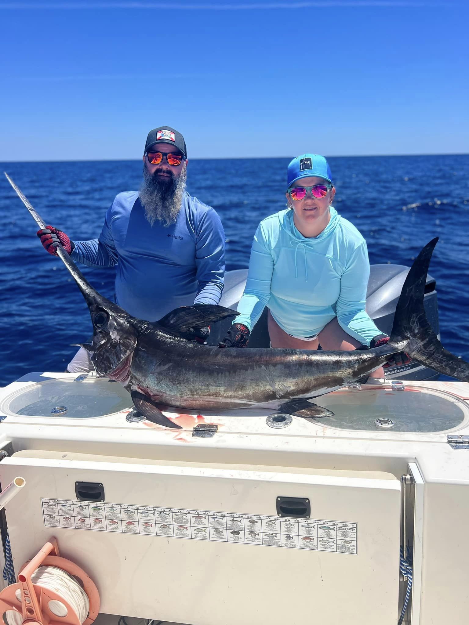 A photo of two people fishing with a large fish in Big Pine Key