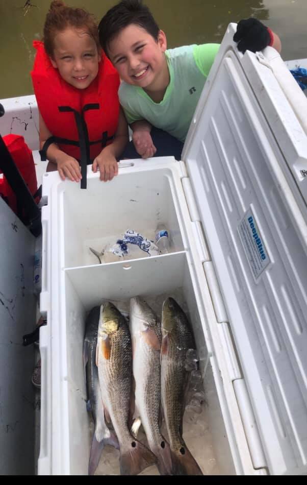 Two redfish measuring 17 inches caught while fishing in Matagorda