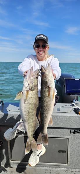 Two walleye caught fishing in Vermilion OH displayed on boat deck