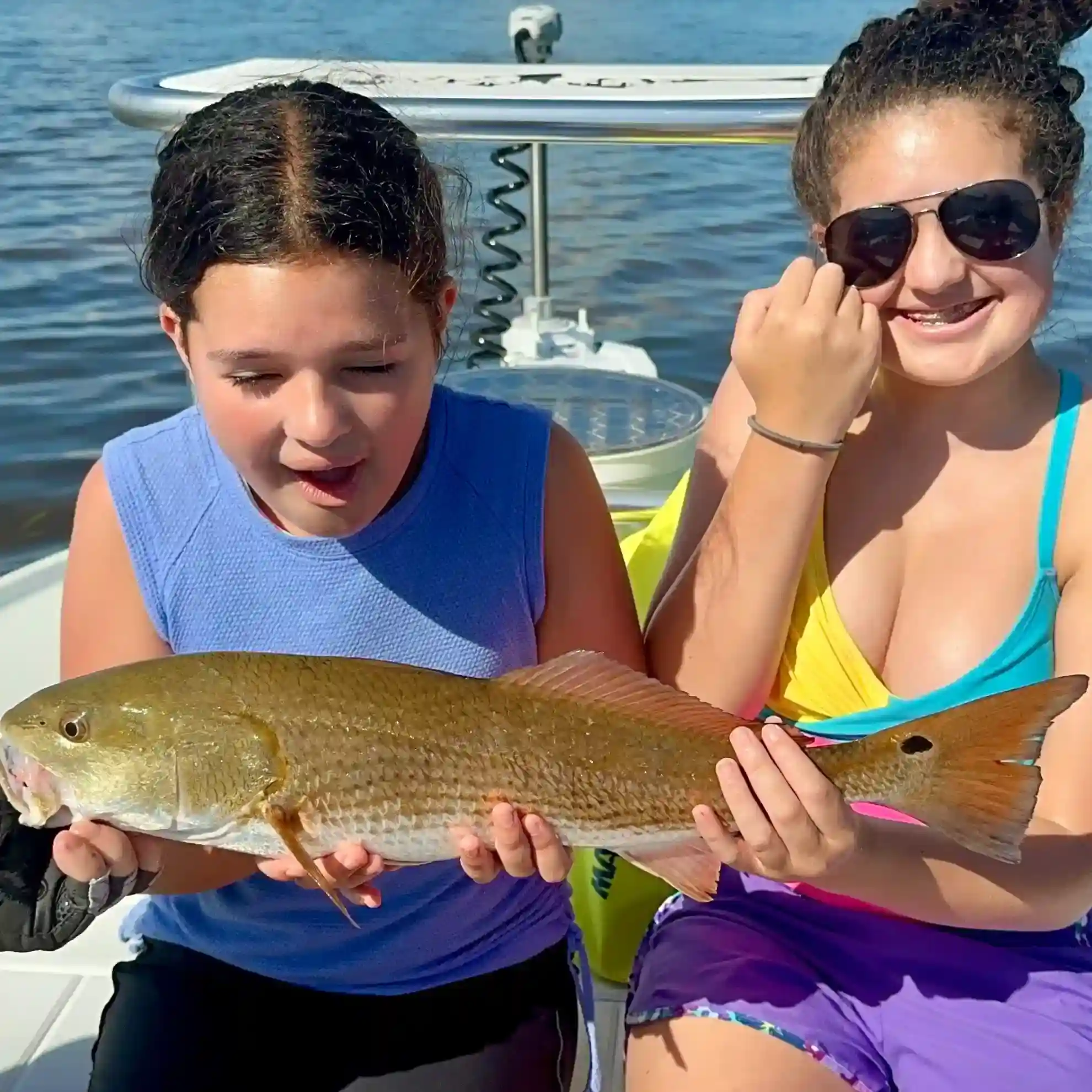 Redfish caught by two anglers in Clearwater
