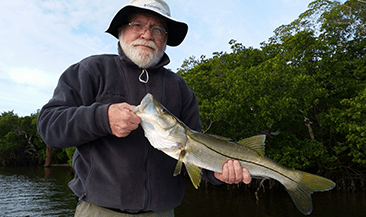 Angler with a snook fish caught in Cape Coral