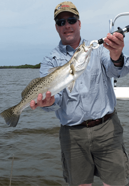 Photo of a single angler fishing in the waters of Cape Coral