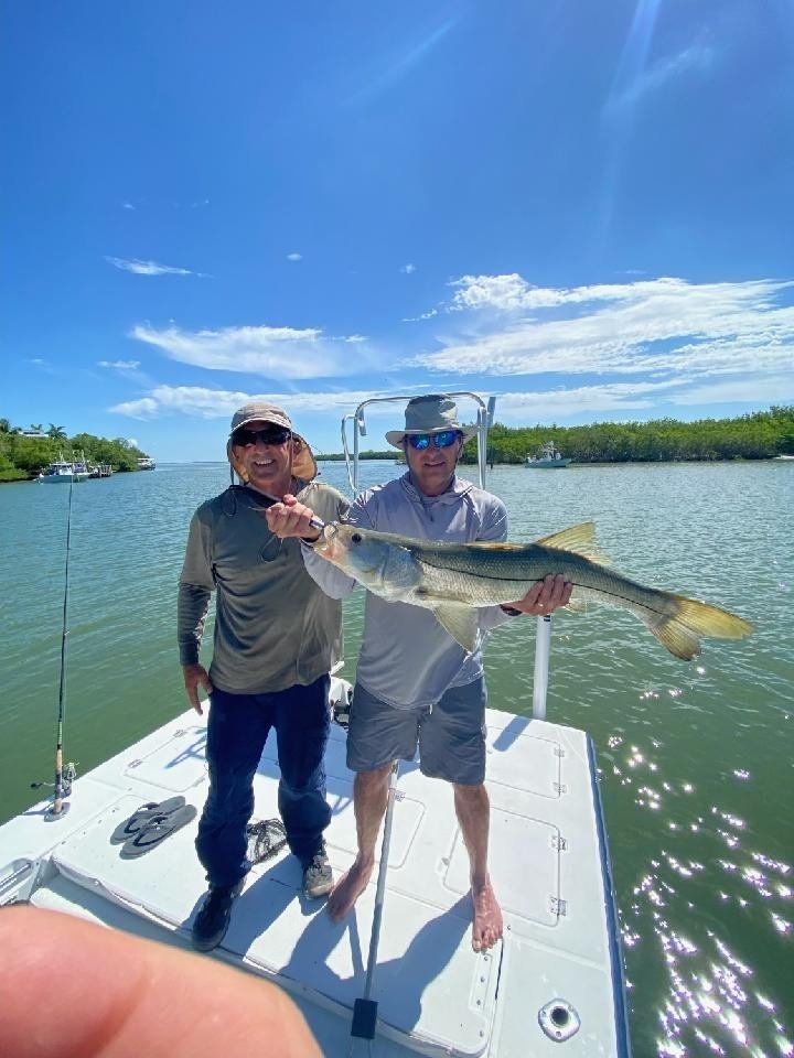 Two people enjoying a day of fishing in Cape Coral