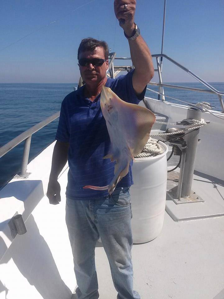 Angler holding a fish in Atlantic City